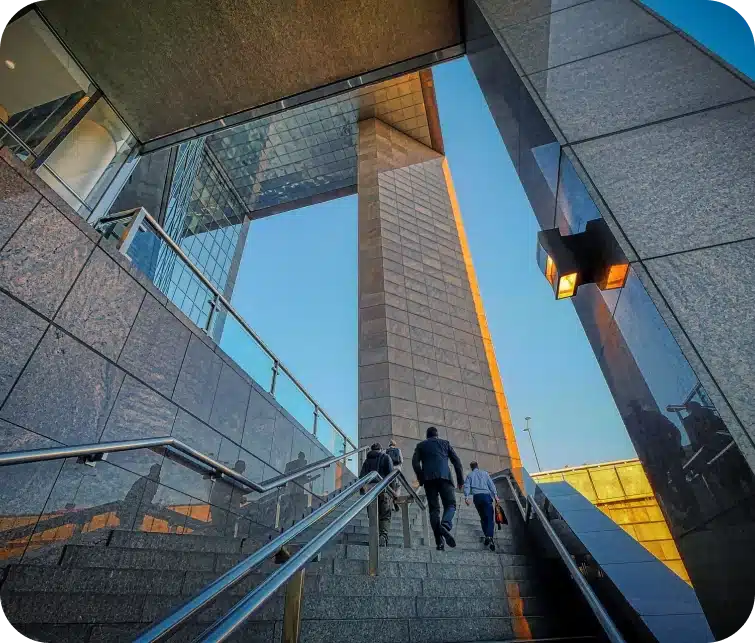 People climbing stairs of a business building